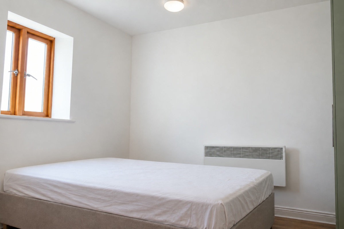 Second bedroom before: white walls, basic bed, no furniture or decoration (recreation)