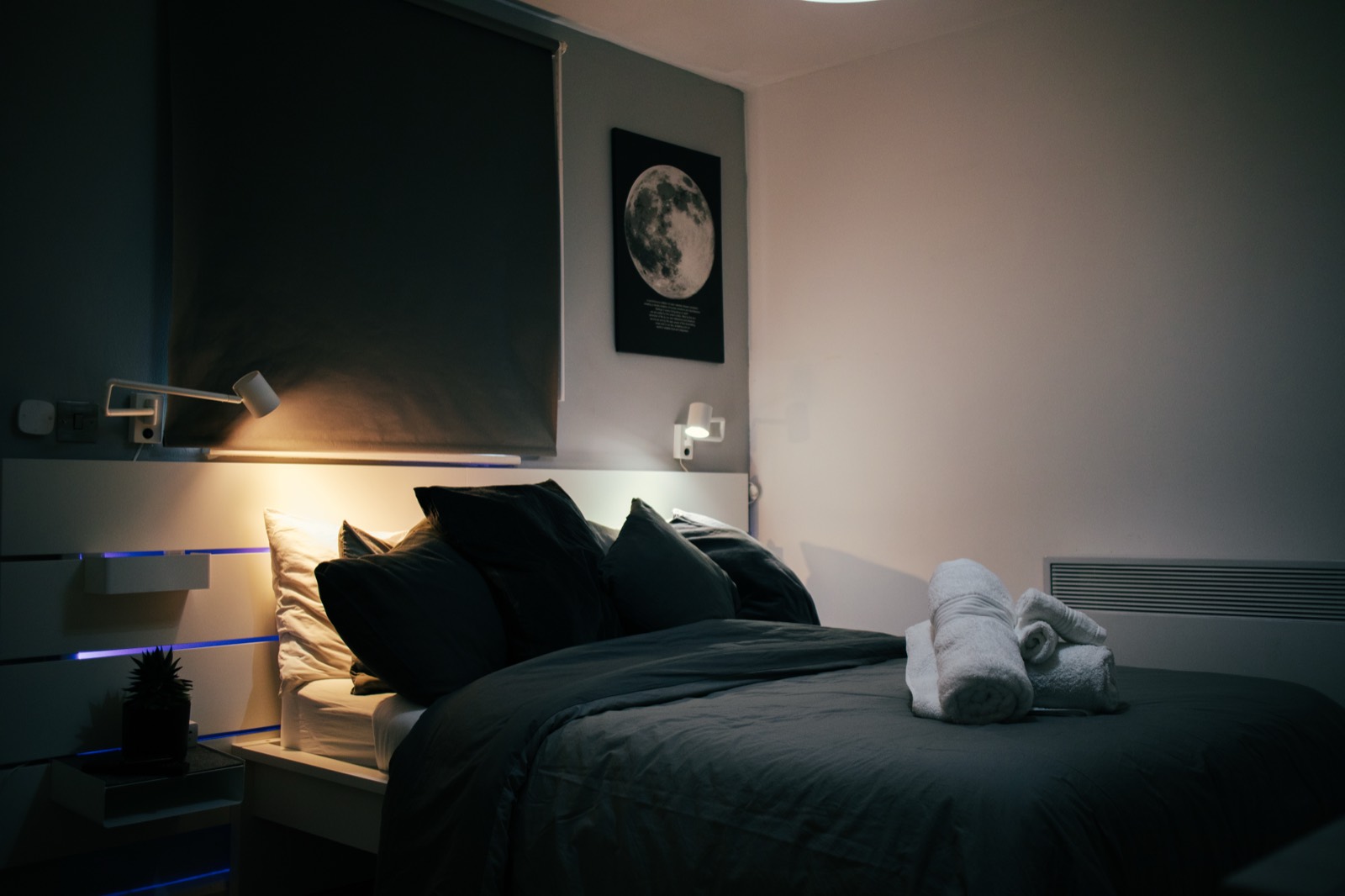 Bedroom with moon print and folded towels